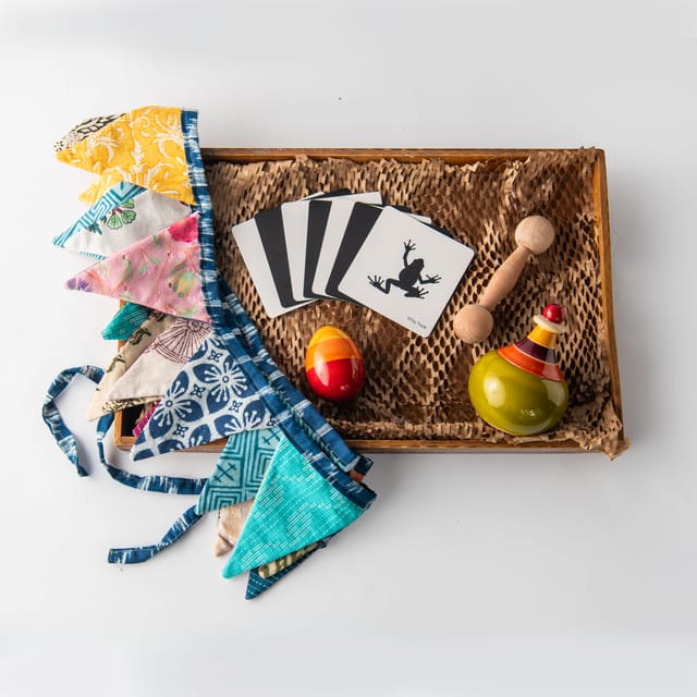 Toy Trunk Tiny Tot Adventure Box (1 egg rattle, 1 Globe wobbler, Dumbell teether, zero waste bunting, flash cards)